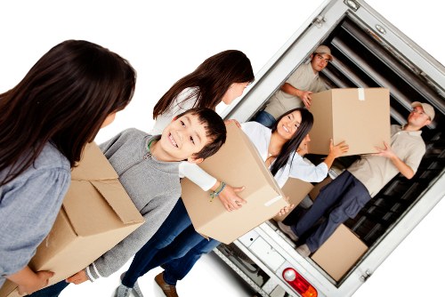 Removal team handling boxes during a UK moving service