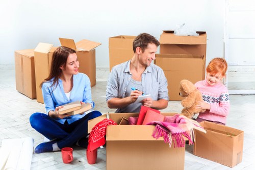 Professional removals team transporting furniture safely