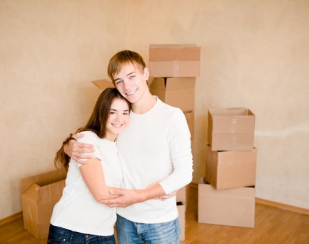 Trained movers handling furniture carefully during a home relocation