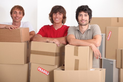 Professional movers loading furniture for office relocation