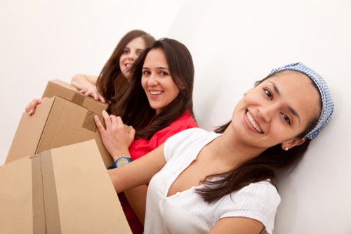 Removal team member safely protecting furniture during a move
