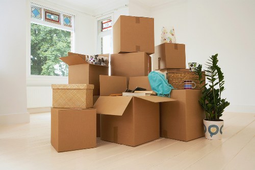 Professional movers handling household items during a London move