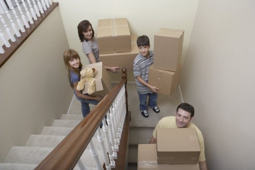 Team member preparing packed boxes for a safe removal process